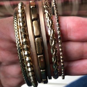 7 gold toned bangle bracelets